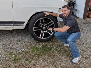 Nathan changing the tires on his 1971 International Travelall.
