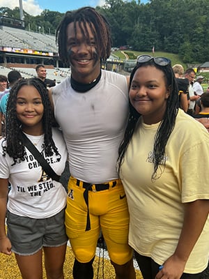 General Manager of Car-Mart Conway, Dishawn Bell, Children. 