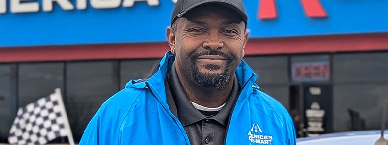 Dishawn Bell, general manager stands in front of the Car-Mart of Conway Arkansas dealership.